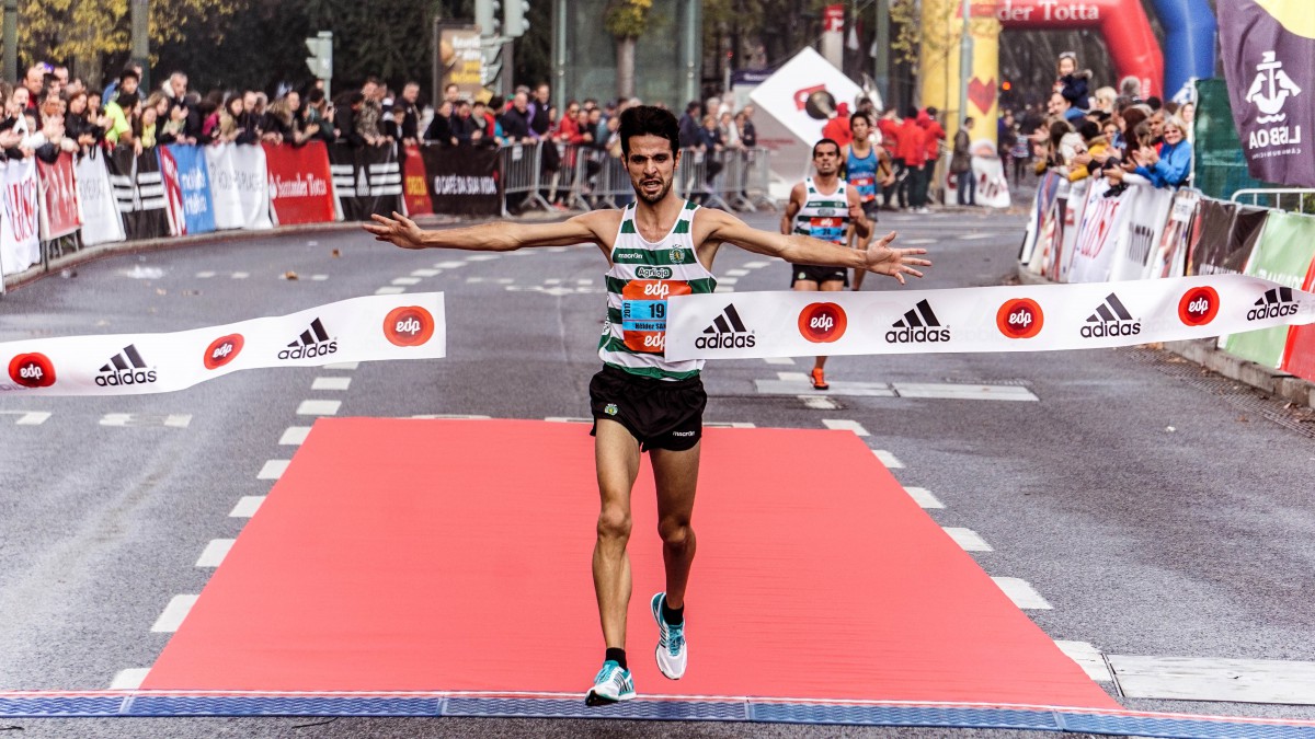 Man passing the finishing line in a race