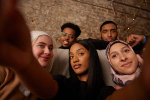 A group of young people posing together for a photograph